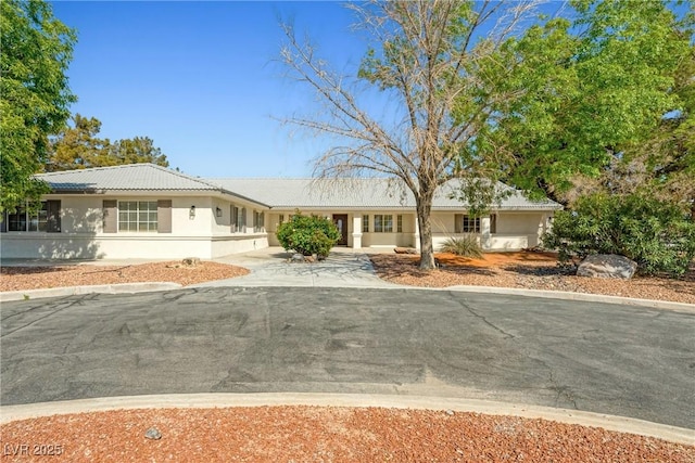 2681 Underbrush Ave, Pahrump, NV 89048 - ranch-style home featuring a tile roof and stucco siding