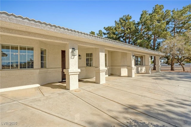 2681 Underbrush Ave, Pahrump, NV 89048 - doorway to property featuring a patio area and stucco siding