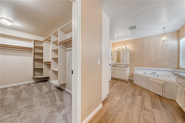 2681 Underbrush Ave, Pahrump, NV 89048 - spacious closet featuring light wood-type flooring and visible vents
