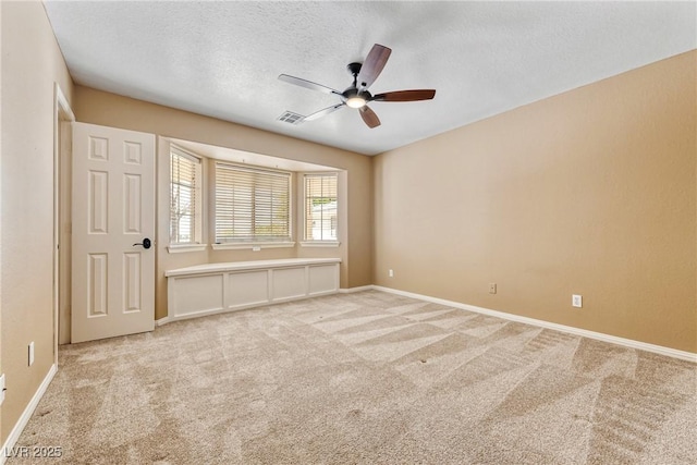 2681 Underbrush Ave, Pahrump, NV 89048 - carpeted empty room featuring ceiling fan, baseboards, a textured ceiling, and visible vents