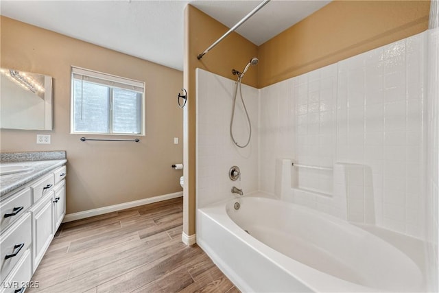 2681 Underbrush Ave, Pahrump, NV 89048 - full bathroom with wood finished floors, toilet, vanity, baseboards, and  shower combination