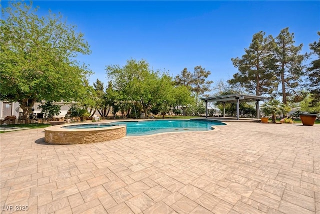 2681 Underbrush Ave, Pahrump, NV 89048 - view of swimming pool with a pergola, a pool with connected hot tub, and a patio