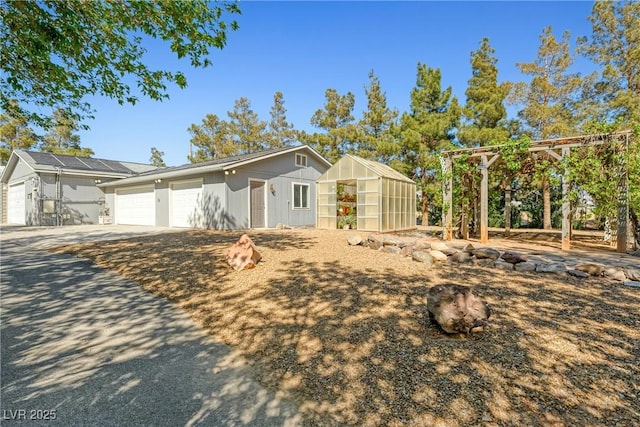 2681 Underbrush Ave, Pahrump, NV 89048 - view of front facade featuring an outbuilding and a greenhouse