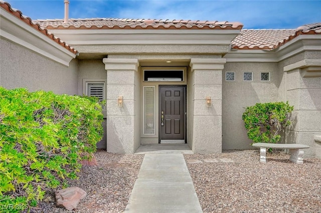 2721 Faiss Dr, Las Vegas, NV 89134 - property entrance featuring stucco siding and a tiled roof