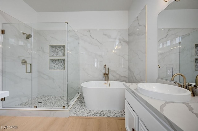 2721 Faiss Dr, Las Vegas, NV 89134 - full bathroom with a marble finish shower, a soaking tub, vanity, and wood finished floors