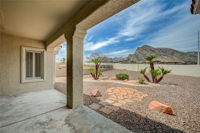 2721 Faiss Dr, Las Vegas, NV 89134 - view of patio / terrace with a mountain view and a fenced backyard