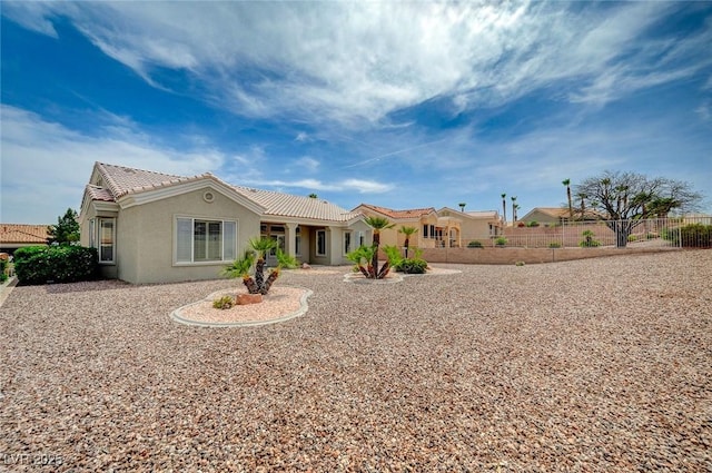 2721 Faiss Dr, Las Vegas, NV 89134 - view of front of house with stucco siding, fence, and a tiled roof