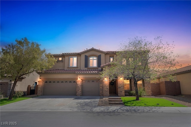 8537 Eureka Heights Ct, Las Vegas, NV 89178 - mediterranean / spanish home featuring stucco siding, an attached garage, a tiled roof, driveway, and stone siding