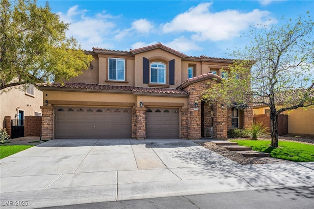 8537 Eureka Heights Ct, Las Vegas, NV 89178 - mediterranean / spanish home with an attached garage, stucco siding, stone siding, concrete driveway, and a tile roof
