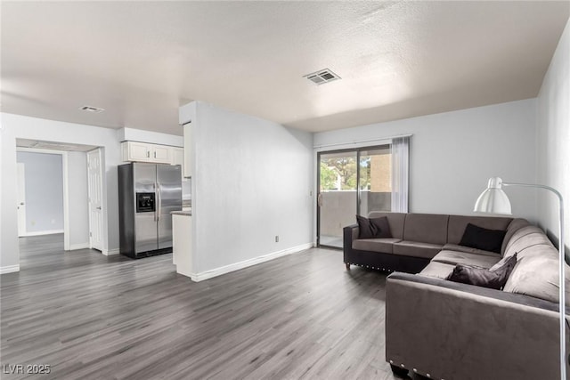 2451 N Rainbow Blvd Unit 1016, Las Vegas, NV 89108 - living room featuring dark wood-style flooring and baseboards