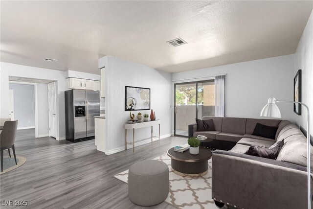 2451 N Rainbow Blvd Unit 1016, Las Vegas, NV 89108 - living room featuring wood finished floors and baseboards