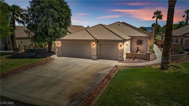 1253 Country Club Dr, Laughlin, NV 89029 - ranch-style house with a tiled roof, driveway, a front yard, a garage, and stucco siding
