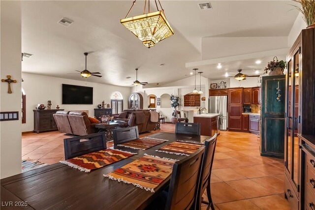 1253 Country Club Dr, Laughlin, NV 89029 - dining room featuring vaulted ceiling, light tile patterned floors, a ceiling fan, and visible vents