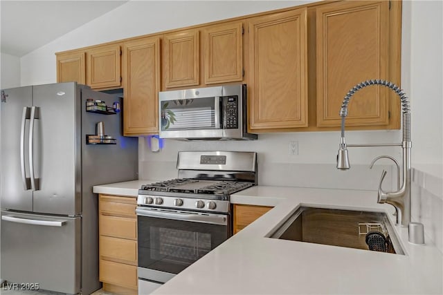 1830 Ginger Blossom Ave, North Las Vegas, NV 89031 - kitchen with stainless steel appliances, a sink, light countertops, and lofted ceiling