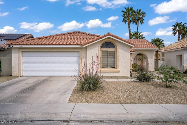 1830 Ginger Blossom Ave, North Las Vegas, NV 89031 - mediterranean / spanish-style house with an attached garage, stucco siding, driveway, and a tiled roof