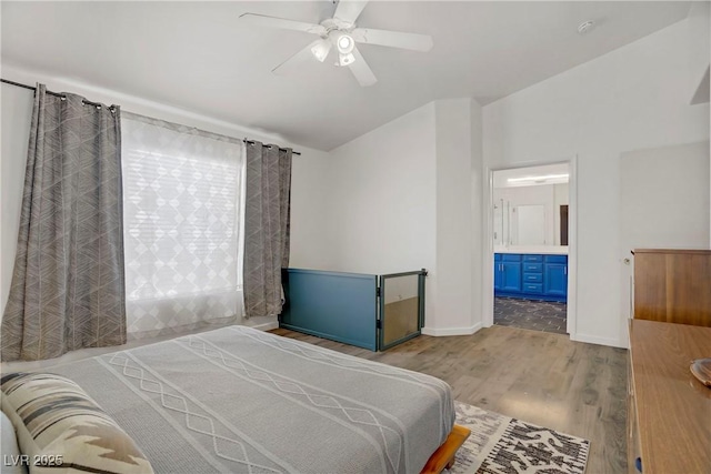 1830 Ginger Blossom Ave, North Las Vegas, NV 89031 - bedroom featuring wood finished floors, a ceiling fan, baseboards, and connected bathroom
