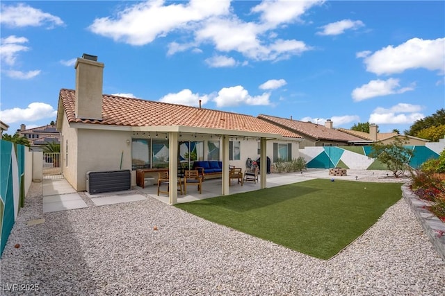 1830 Ginger Blossom Ave, North Las Vegas, NV 89031 - back of house with an outdoor hangout area, stucco siding, a fenced backyard, a tiled roof, and a patio