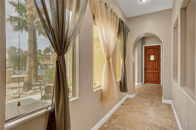 519 Via Garofano Ave, Henderson, NV 89011 - hallway with arched walkways, plenty of natural light, and baseboards