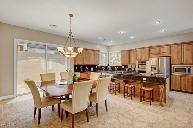 519 Via Garofano Ave, Henderson, NV 89011 - dining area with a chandelier, recessed lighting, and baseboards