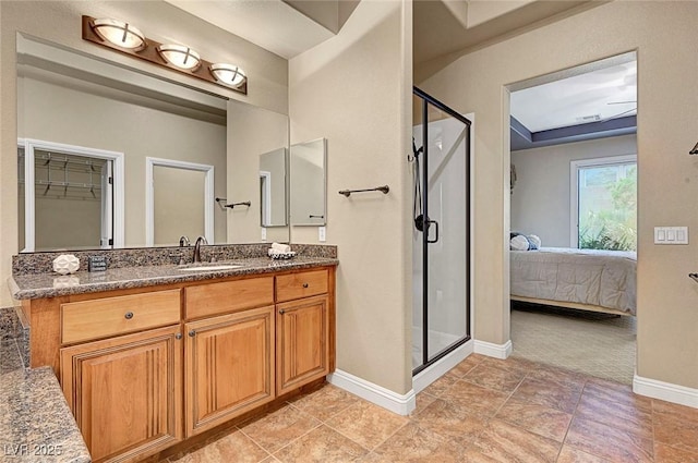 519 Via Garofano Ave, Henderson, NV 89011 - ensuite bathroom with a shower stall, baseboards, and vanity