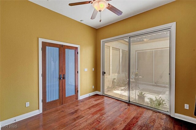 519 Via Garofano Ave, Henderson, NV 89011 - unfurnished room with french doors, wood finished floors, ceiling fan, and baseboards