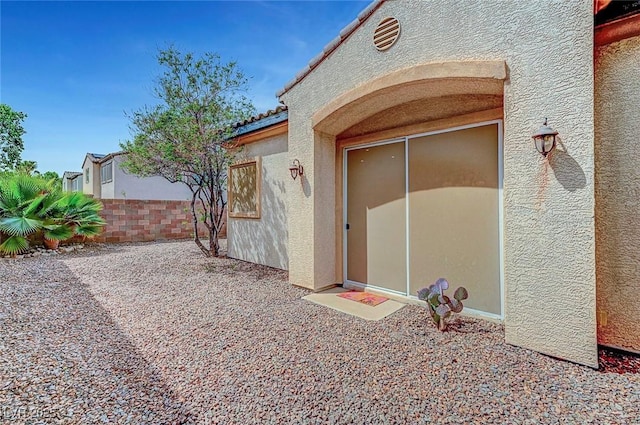 519 Via Garofano Ave, Henderson, NV 89011 - doorway to property with stucco siding, a patio area, and a tiled roof