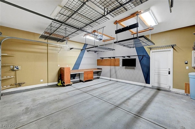 519 Via Garofano Ave, Henderson, NV 89011 - garage featuring baseboards and a garage door opener