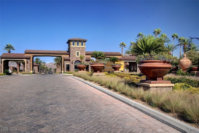 519 Via Garofano Ave, Henderson, NV 89011 - view of front of property featuring a tiled roof, stone siding, and stucco siding