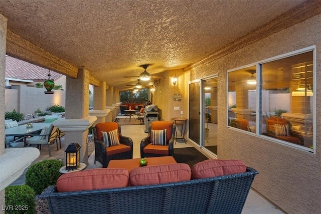 view of patio featuring outdoor dining space, ceiling fan, and an outdoor hangout area