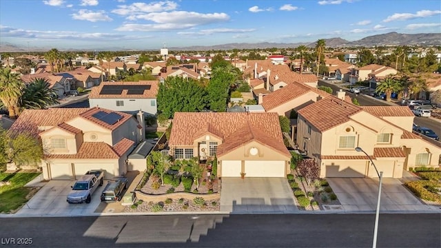 drone / aerial view with a residential view and a mountain view