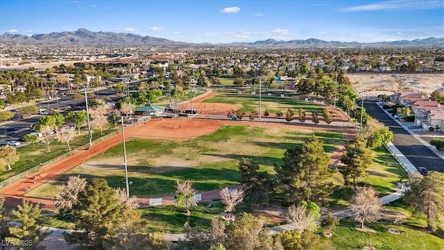 birds eye view of property featuring a mountain view