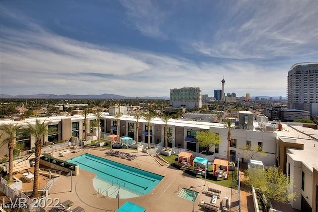 pool with a city view and a patio area