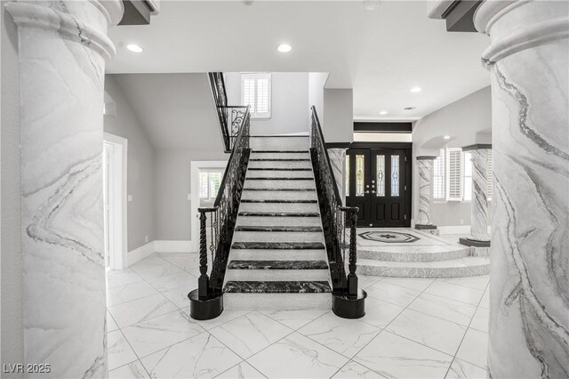stairs featuring baseboards, marble finish floor, and recessed lighting