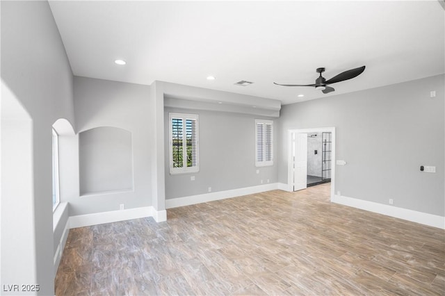 unfurnished living room featuring recessed lighting, visible vents, baseboards, and ceiling fan