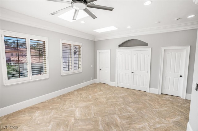 unfurnished bedroom with baseboards, recessed lighting, two closets, and crown molding