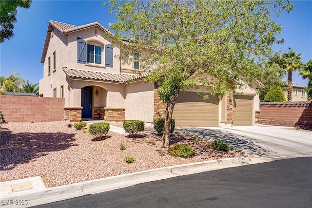 mediterranean / spanish-style house with a tiled roof, fence, stone siding, and stucco siding