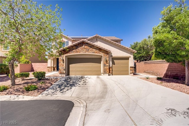 view of front of property featuring a tile roof, a garage, concrete driveway, stone siding, and stucco siding