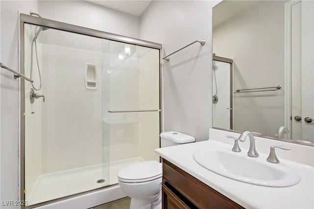 full bath with toilet, a shower stall, and vanity