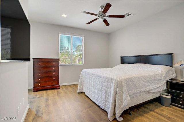 bedroom featuring visible vents, wood finished floors, baseboards, recessed lighting, and a ceiling fan