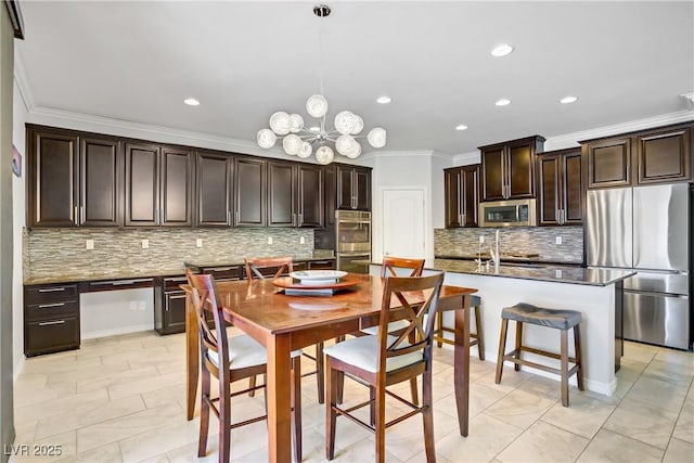 dining area featuring ornamental molding, recessed lighting, and a notable chandelier