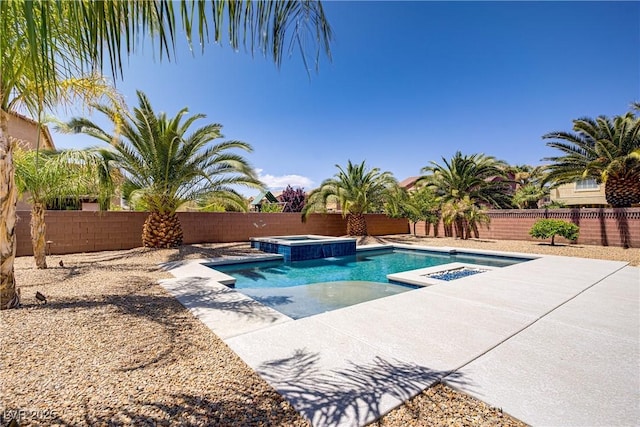 view of swimming pool with a patio, a pool with connected hot tub, and a fenced backyard
