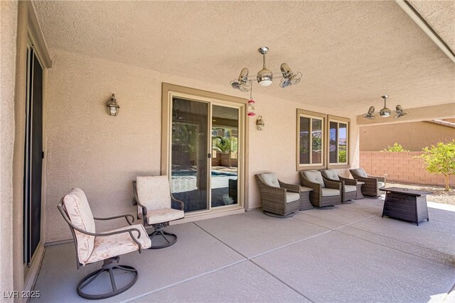 view of patio featuring fence