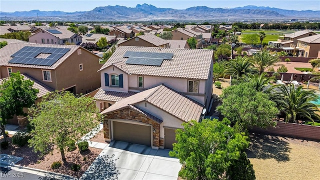 drone / aerial view featuring a mountain view and a residential view