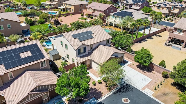 birds eye view of property with a residential view