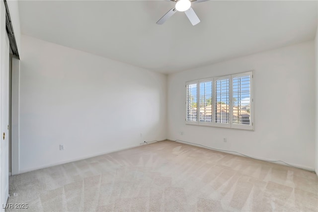 spare room with ceiling fan and carpet flooring