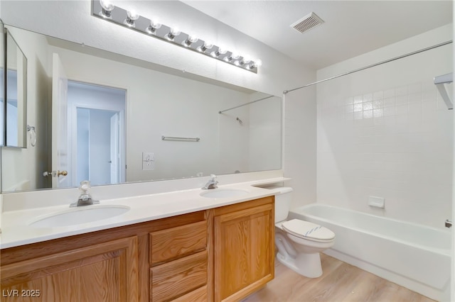 full bath with shower / tub combination, visible vents, toilet, and a sink