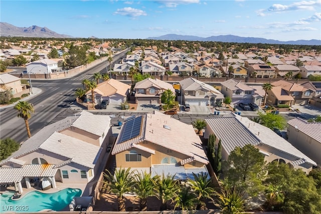aerial view featuring a mountain view and a residential view