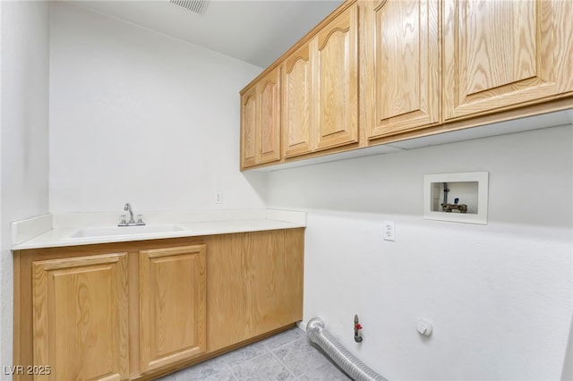 laundry area with a sink, gas dryer hookup, visible vents, hookup for a washing machine, and cabinet space