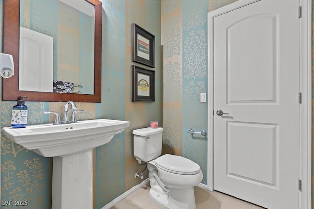 1776 Gentle Brook St, North Las Vegas, NV 89084 - bathroom with toilet, baseboards, and wallpapered walls
