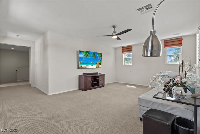 1776 Gentle Brook St, North Las Vegas, NV 89084 - carpeted living area featuring a healthy amount of sunlight, baseboards, a ceiling fan, and visible vents